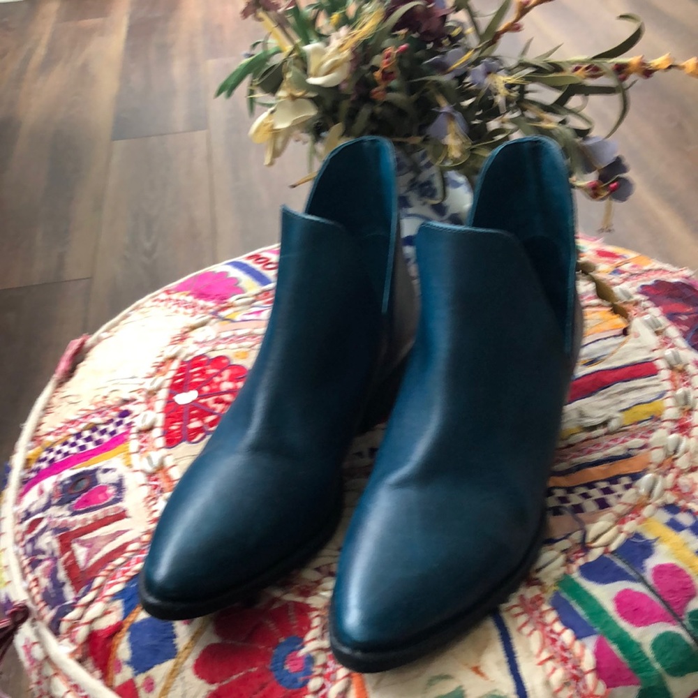 Women leather boots, dark reel color. Very fashionable.